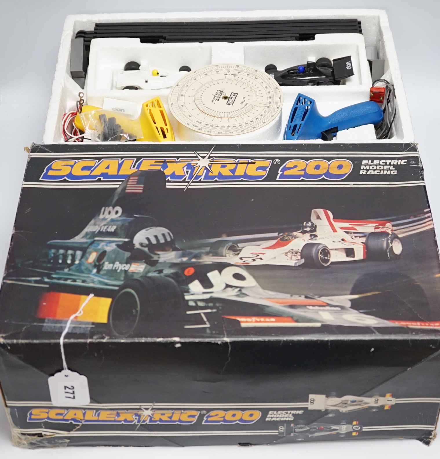 A Scalextric 200 set, comprising of two cars, controllers, track sections, etc.
